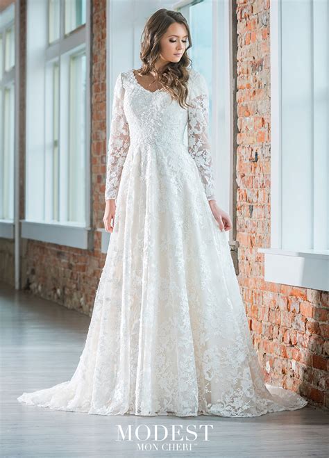 Lace Flows Over A Stretch Lining To Create An A Line Silhouette In This Modest Bridal By Mon Che