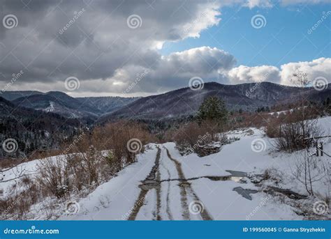 Dirt Road With Melting Snow Among The Mountains Stock Image Image Of