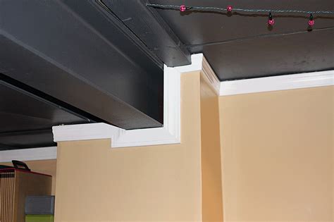 Add lighting if you want, and get the wood beams installed. Flat Black Paint Basement Ceiling Ideas | Basement ...