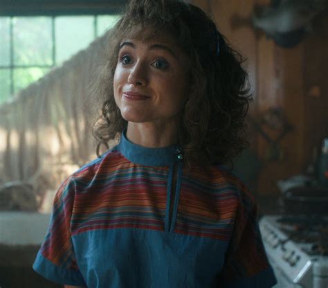 blue with multicolor stripes top of natalia dyer as nancy wheeler in stranger things tv show