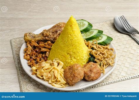 Nasi Tumpeng Or Nasi Kuning Is A Cone Shaped Rice With Various Side