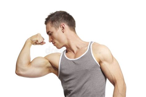 Muscular Young Man Flexing Arm Muscles In Sports Outfit Stock Image