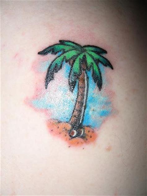 This is a nice looking grey scale daisy tattoo on the wearer's side. Small colorful tattoo with palm tree - Tattooimages.biz
