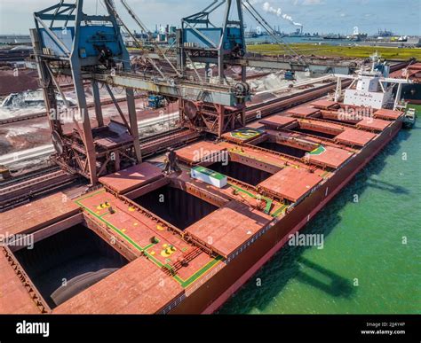 Bulk Carrier Ship Unloading Cargo By Crane At Port Stock Photo Alamy