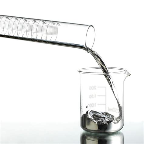 Mercury Pouring From A Measuring Cylinder By Science Photo Library