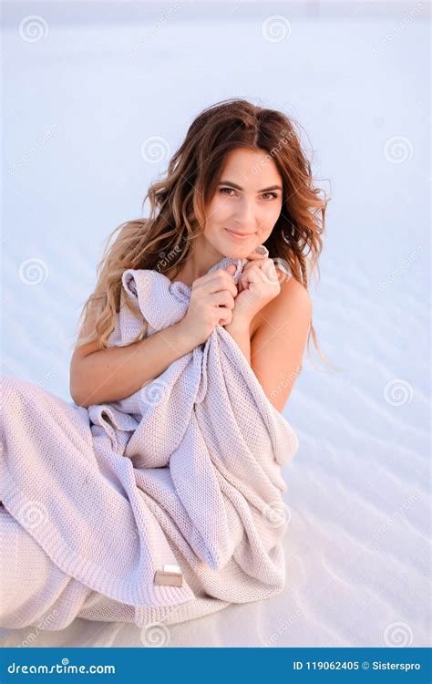 Beautiful Female Person Wrapped In Blanket Sitting On White Sand Stock Image Image Of