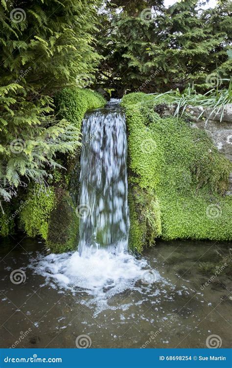 Waterfall Flowing Into River Stock Photo Image Of Natural Moss 68698254