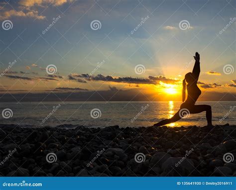 Silhouette Young Woman Practicing Yoga On The Beach At Sunset Healthy