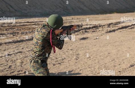 Iraqi Soldier Firing Ak 47 Assault Rifle At Shooting Range Stock Video