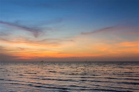 Seacoast Skyline With Sunset Sky Background Stock Photo Download