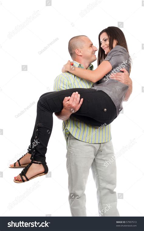 Man Carrying A Beautiful Woman In His Arms Stock Photo 57997513