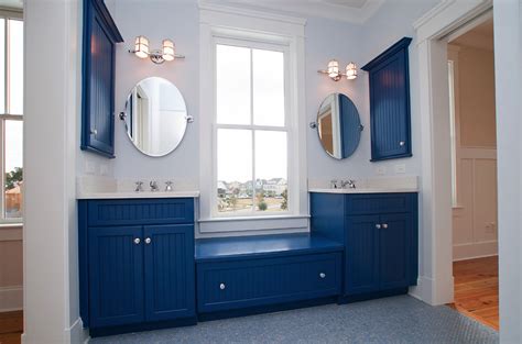 Muted blue grey walls painted above the white beadboard. Bathed in color: When to use blue in the bathroom - Philly