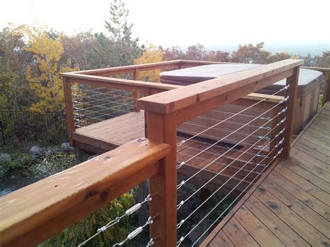 Install your posts at the top and bottom of your stairs. Park City Wood and Deck, Stylists: Cable rail with deck ...