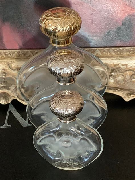 Three Graduating In Size Vintage Lalique Designed Perfume Bottles By