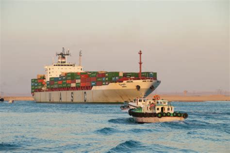The suez canal authority (sca) said it had lost the ability to steer amid high winds and a dust bernhard schulte shipmanagement (bsm), the ship's technical manager, said it ran aground in the. Container Ship Suez Canal In Egypt Stock Photo - Download Image Now - iStock