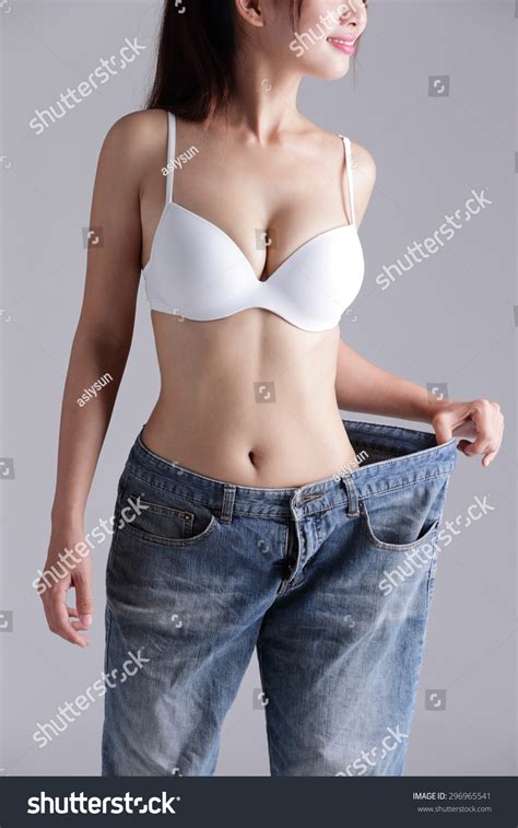 Woman Shows Weight Loss By Wearing Stock Photo 296965541 Shutterstock