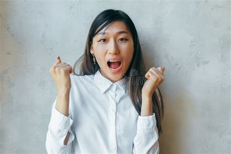 Excited Overjoyed Beautiful Asian Girl Feel Happy Looking At Camera