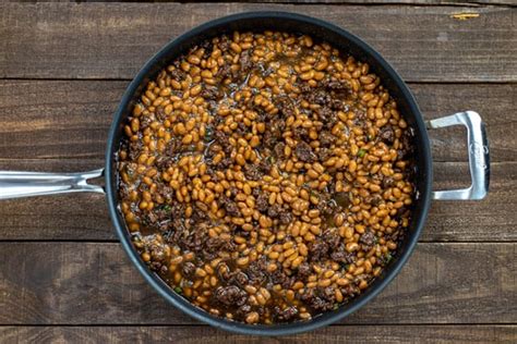 Upgrade baked beans from classic side dish to a meaty main meal by adding lean ground beef. Recipe For Bush Baked Beans With Ground Beef - Fallbrook GSL