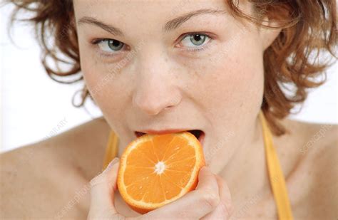 Woman Eating An Orange Stock Image P9200494 Science Photo Library
