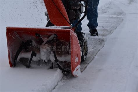 Snow Blowing A Driveway On A Blustery Winter Day Stock Photo Image Of