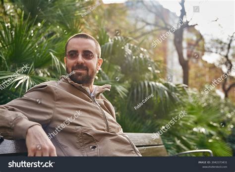 Carefree Man Casually Sitting On Bench Stock Photo 2042373431