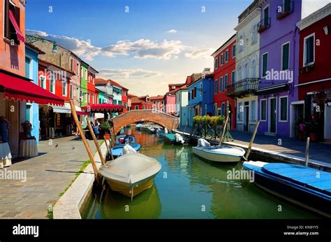 Bright Colorful Houses And Water Street In Burano Italy Stock Photo