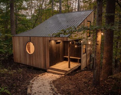 This Small House In The Forest Has High Ceilings To Allow For Two Loft