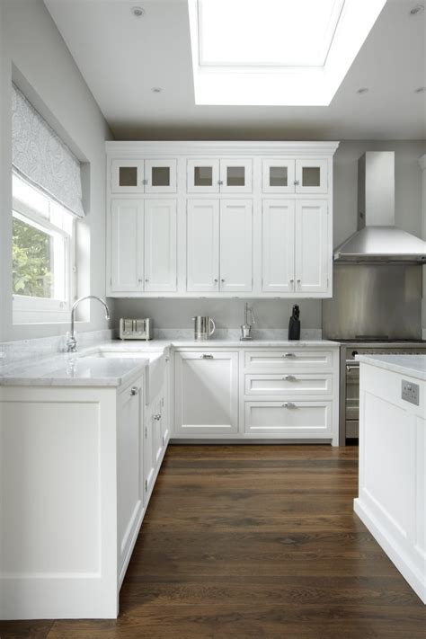 The shaker frame and recessed beadboard center panel is all cottage charisma. Hampton American Style Kitchen - Higham Furniture