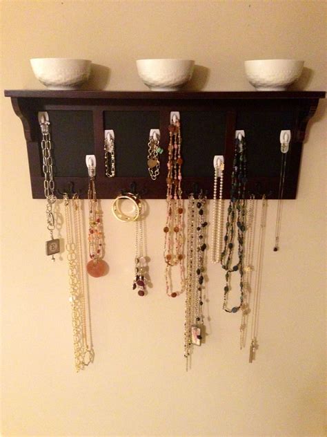 Showcase your jewelry with this easy diy project! Do it yourself jewelry storage system. We live in a rental and didn't want to spend a whole lot ...