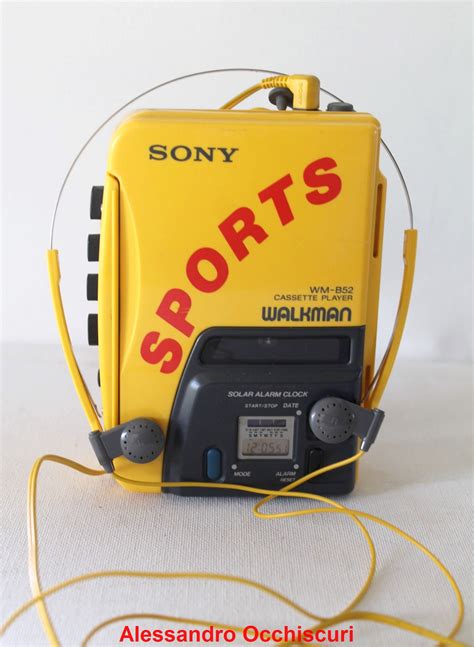 A Yellow Sports Radio With Headphones Attached To Its Sides And The