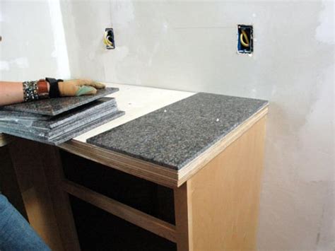 Use of adhesive tile matting, which is cut with a scissors to fit the bathroom countertop surface, is a clean method of installation for a quick bathroom. How to Install A Granite Tile Kitchen Countertop | how-tos ...