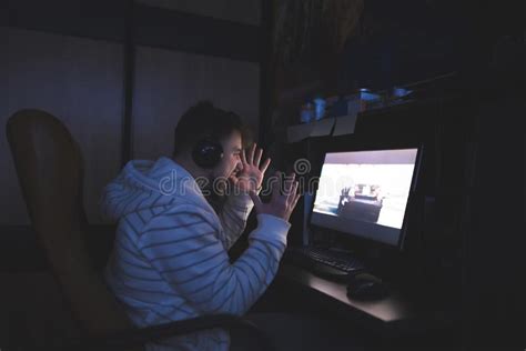 Emotional Young Man Plays Computer Games And Is Nervous Lose In The