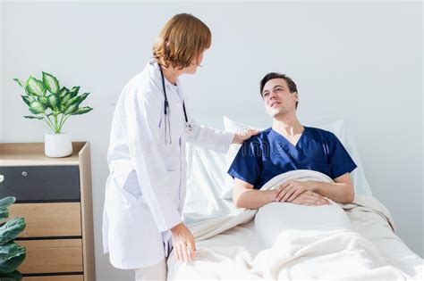 The Doctor Is Examining The Patient In The Hospital Caucasian Female