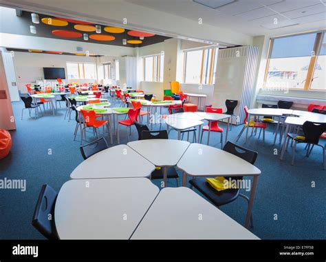 Unoccupied Modern School Classroom With Desks In A Circle Stock Photo