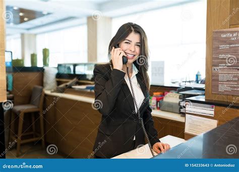 Mid Adult Receptionist Talking On Phone Stock Image Image Of Hispanic