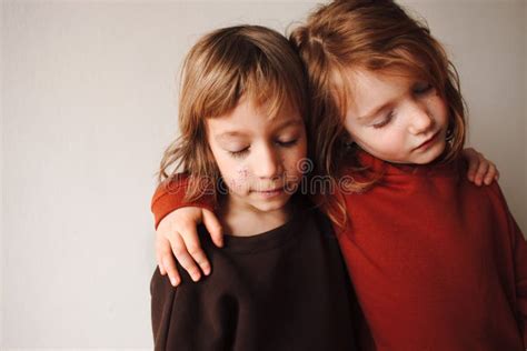 Two Little Girls Best Friends With Closed Eyes Hugging Stock Image