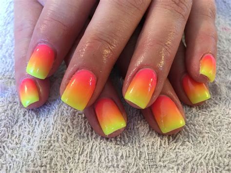 #dont mind me #ive got like #sunset nails #pink and orange and yellow #and a lil blue flower on my ring. Neon pink orange and yellow nails fade | Yellow nails ...