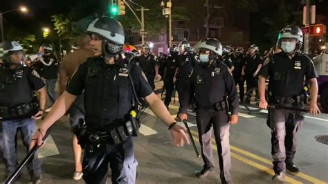 police in riot gear disperse crowd at washington square park