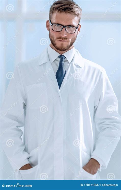Portrait Of Smiling Doctor Standing In Hospital Stock Photo Image Of
