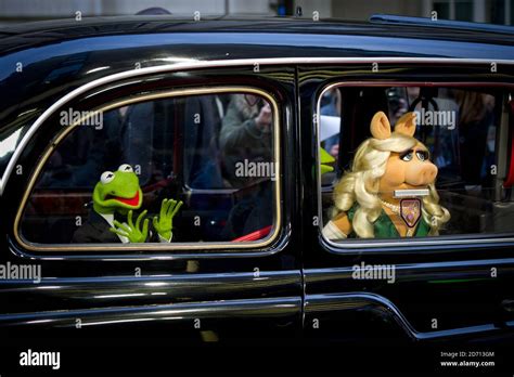 Miss Piggy And Kermit The Frog Arriving At The Premiere Of Muppets Most
