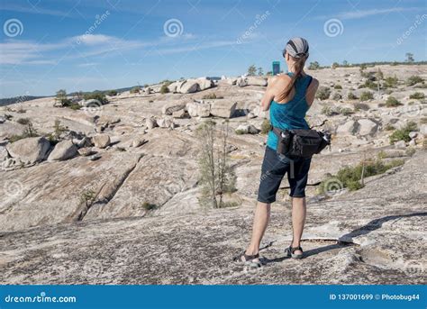 Woman Hiker Taking Picture Of Rugged Landscape Stock Image Image Of