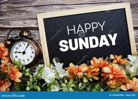 Happy Sunday Typography Text Written On Wooden Blackboard With Flower