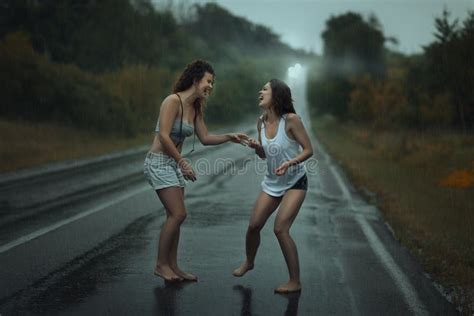 Girls Lesbians Kissing Under The Heavy Rain Stock Image Image Of