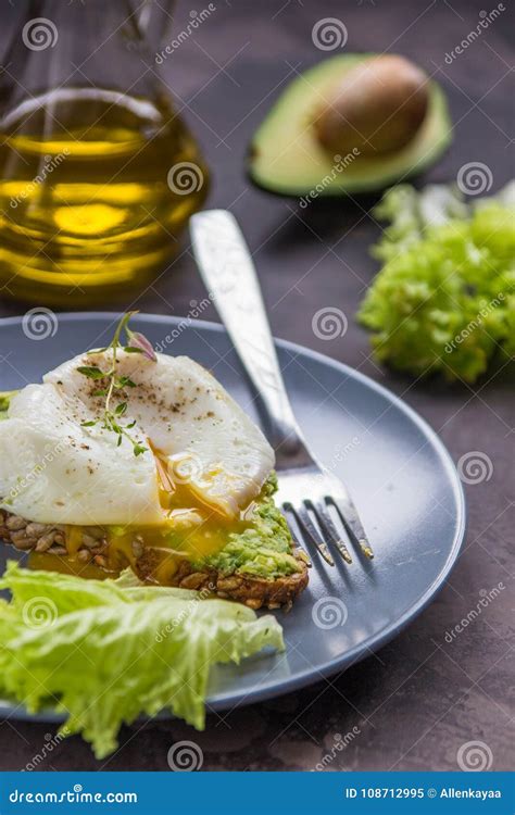 Sandwich With Avocado And Poached Egg Healthy Breakfast Stock Image