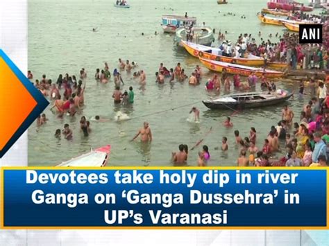 Devotees Take Holy Dip In River Ganga On Ganga Dussehra In Ups Varanasi