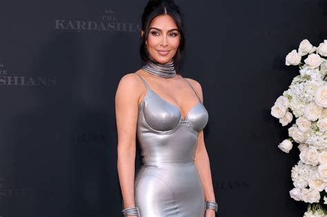 kim kardashian stuns in metallic silver dress at the kardashians premiere