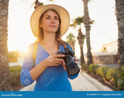 Photographer Tourist Woman Taking Photos With Camera In A Beautiful Tropical Landscape At Sunset