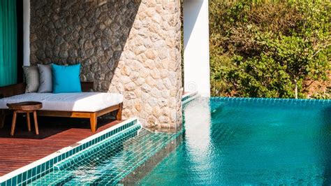 Resort Daybed By The Turquoise Edgeless Pool Editorial Photography Image Of Paradise