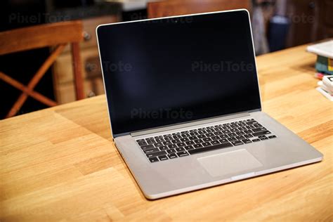 View Of A Laptop On A Wooden Stock Photo Pixeltote