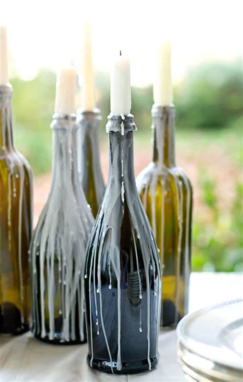 dripping candles in wine bottles photography by lauren michal event design